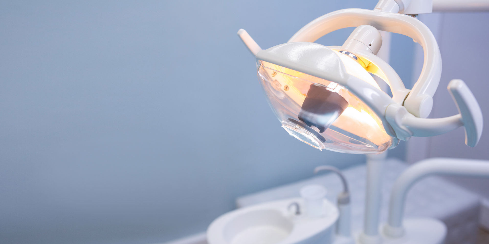 An overhead dental light in a treatment room